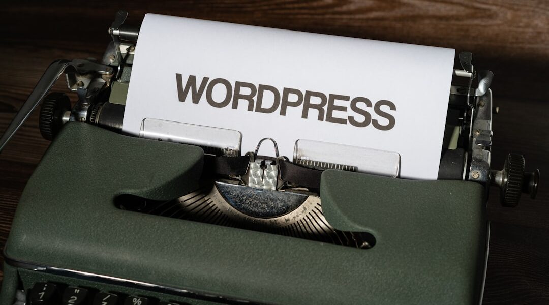 a close up of a typewriter with the word wordpress printed on it