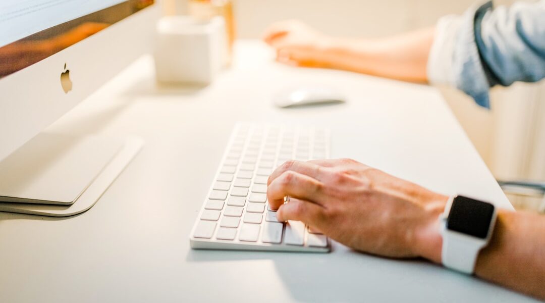 person using iMac
