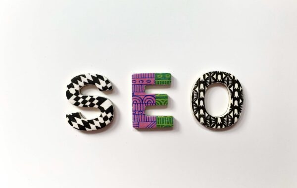The letters S, E, and O with patterned surfaces on a white background